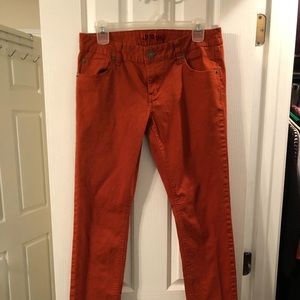Rust color skinny jeans